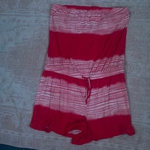 Red nn white mixed romper , sleeveless, string tie at the bottom. Size L